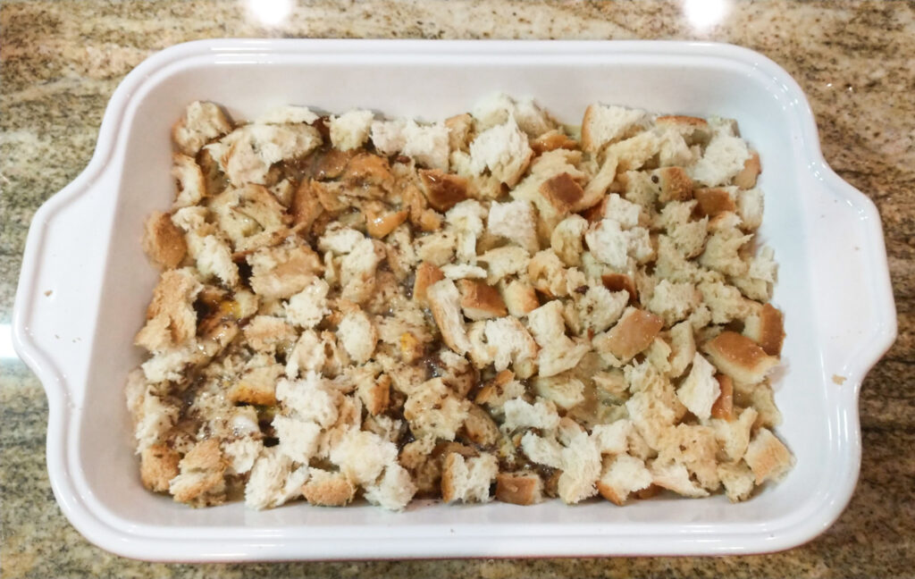 broken up bread in baking dish