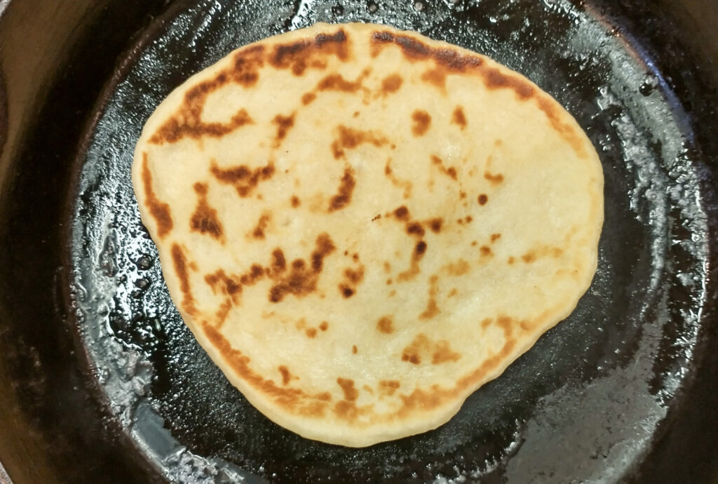 flipped flatbread in pan