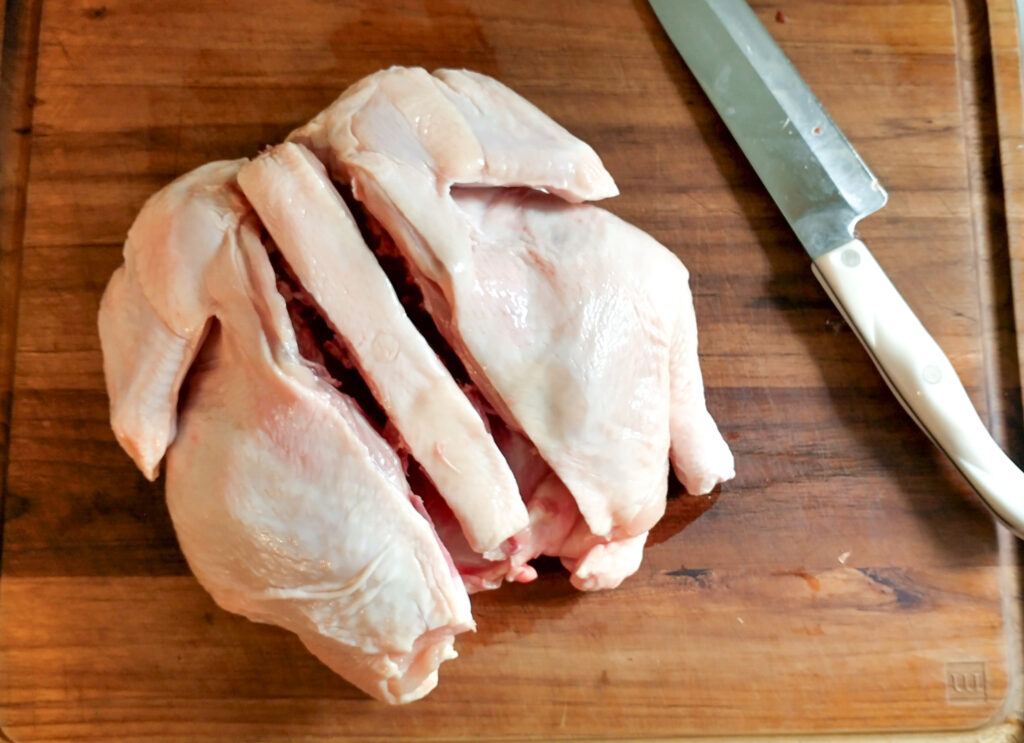 cutting spine out of chicken