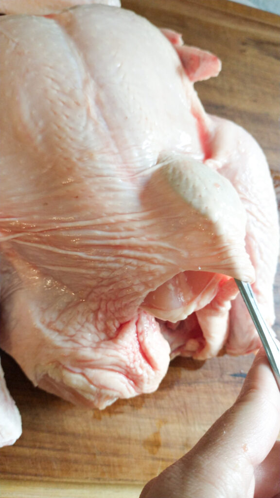 loosening the skin from the meat