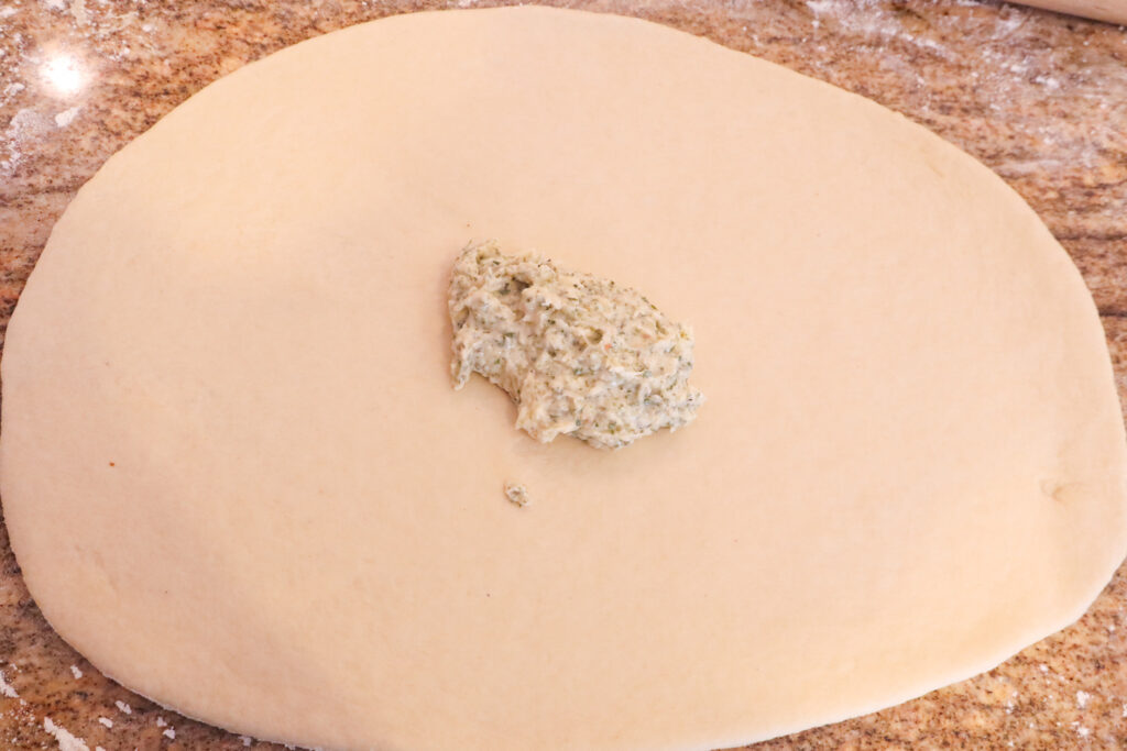 adding the parmesan garlic butter to the dough