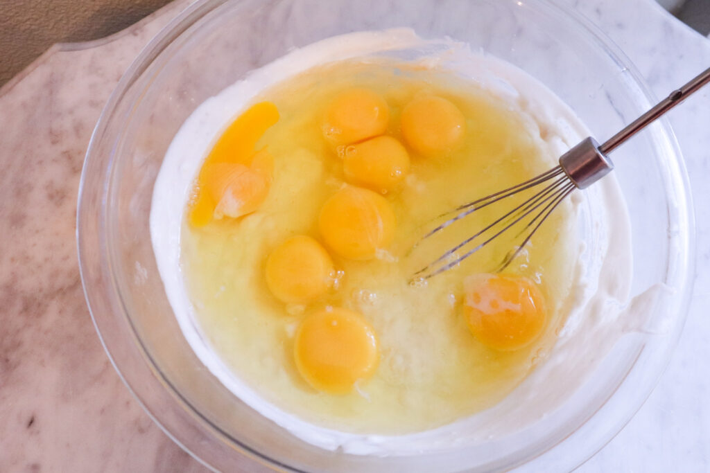 mixing in the eggs for yogurt crepe recipe