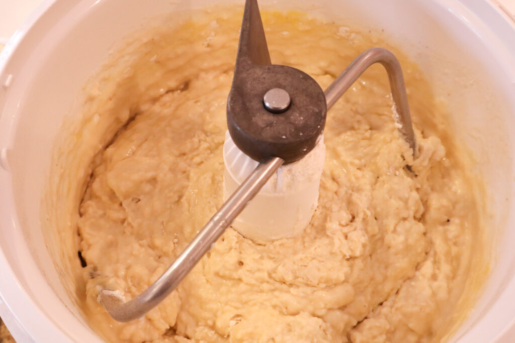 adding flour to the dough