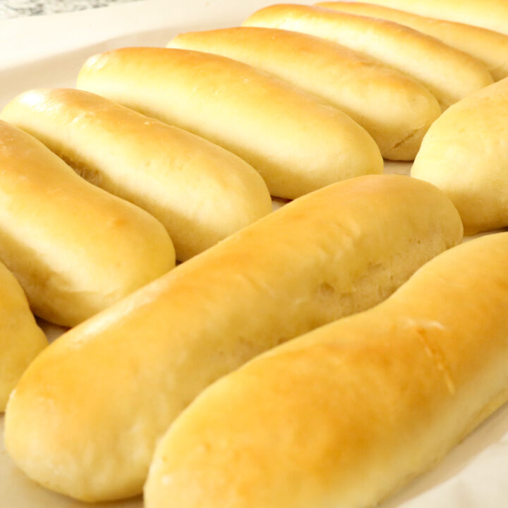 homemade hot dog buns on baking sheet