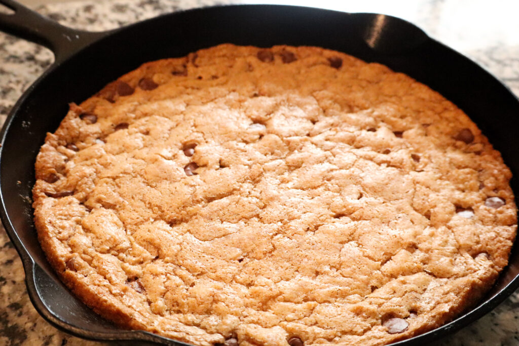 chocolate chip skillet cookie in cast iron skillet