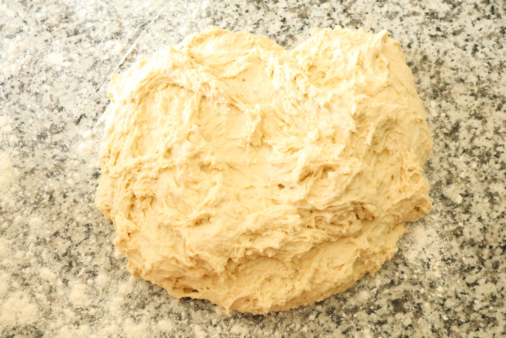 turning dough onto floured work surface