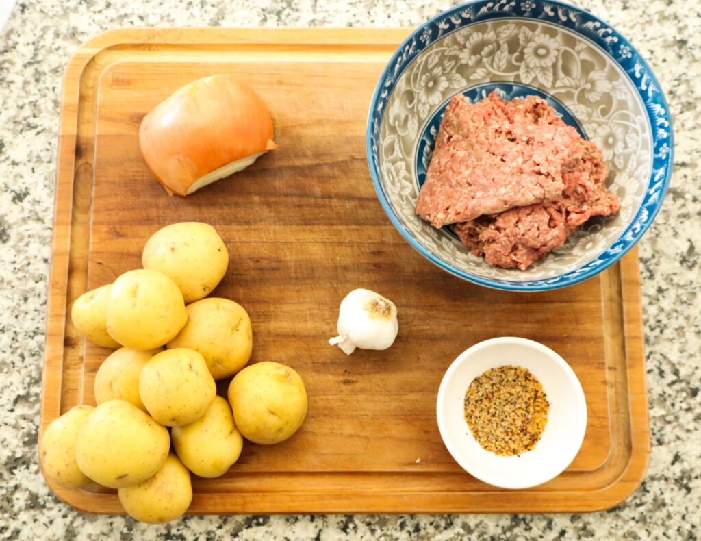 ingredients on cutting board for beef and potato skillet