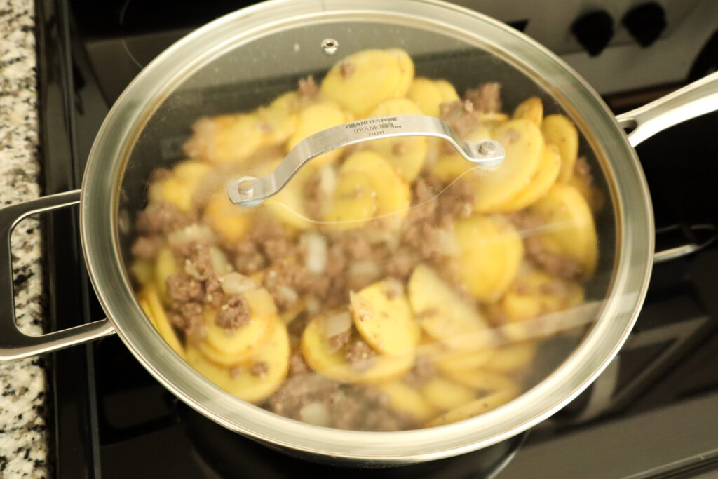 covering beef and potato skillet with lid