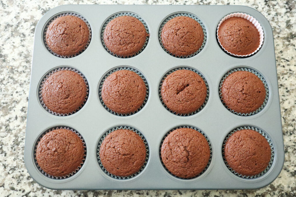 fully cooked cupcakes in muffin tin