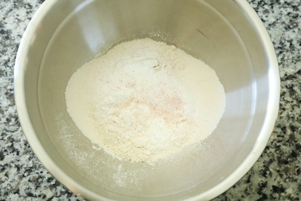 sifted dry ingredients for honey cupcakes in mixing bowl