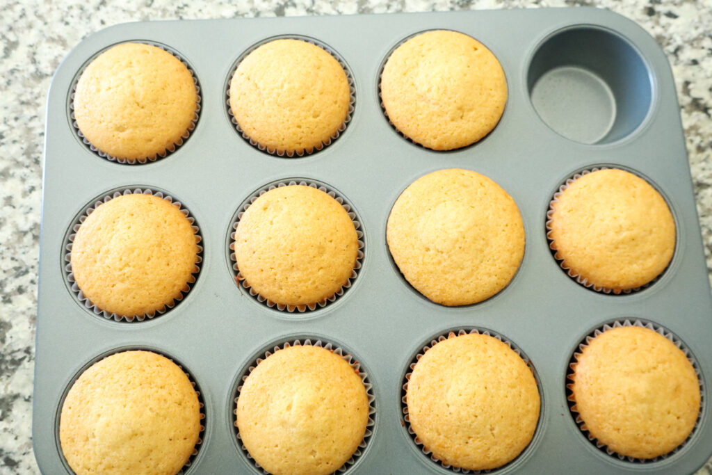 fully cooked honey cupcakes in muffin tin