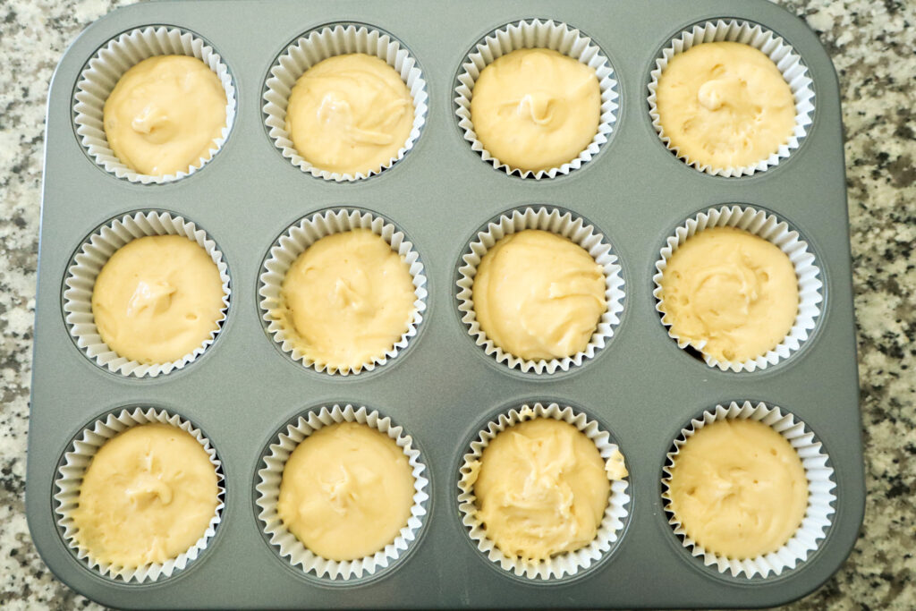 cupcake batter in muffin tin ready to be baked