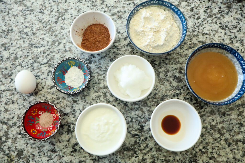 ingredients for honey sweetened chocolate cupcakes on counter