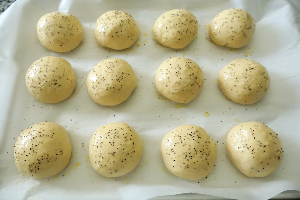 burger buns with black pepper sprinkled on top