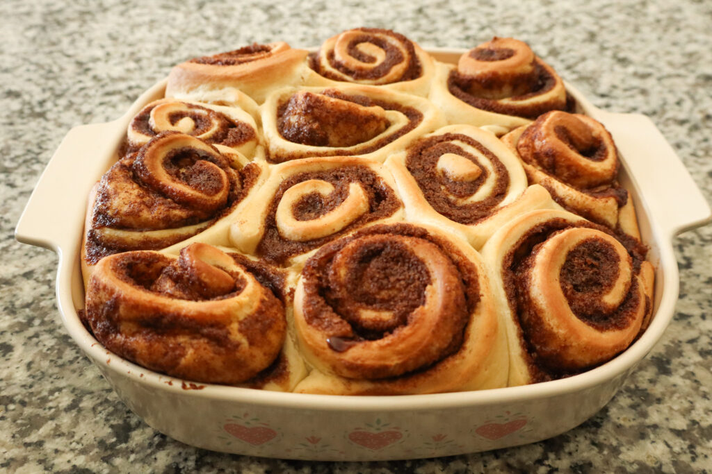 fully cooked cinnamon rolls in baking pan