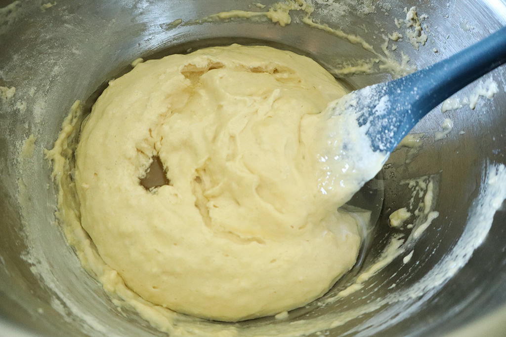 melted coconut oil poured over refined sugar free strawberry shortcakes batter
