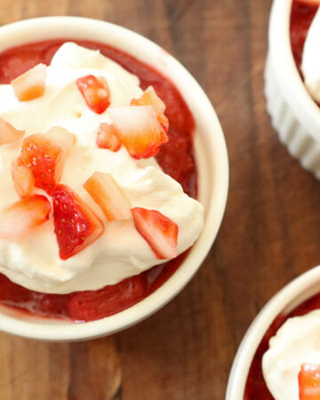 refined sugar free strawberry shortcakes topped with jam, whipped cream and diced strawberries