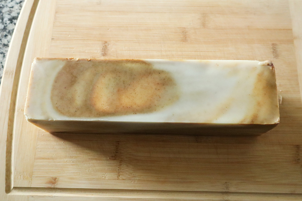 unmolded loaf of cold processed chocolate swirl tallow soap