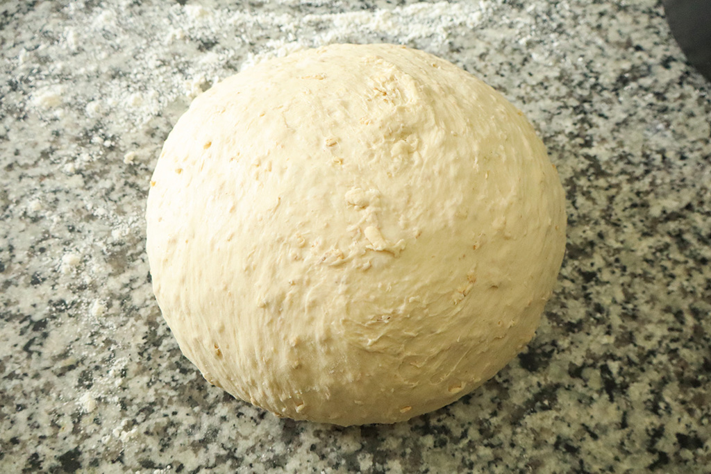 dough ball on floured counter