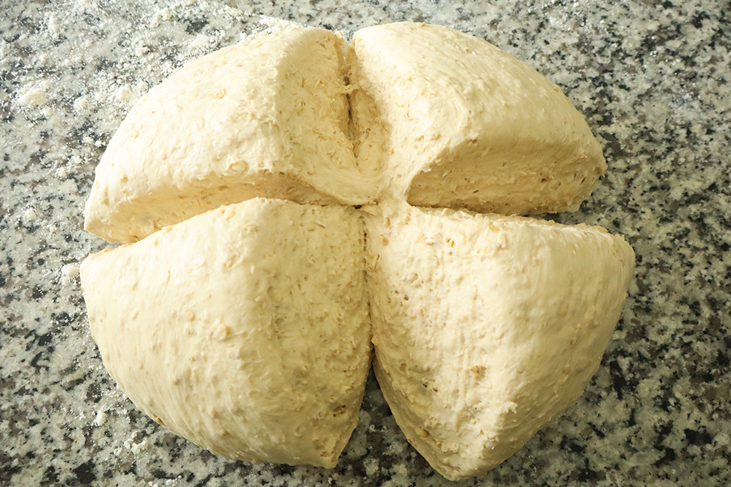 dough ball cut into quarters