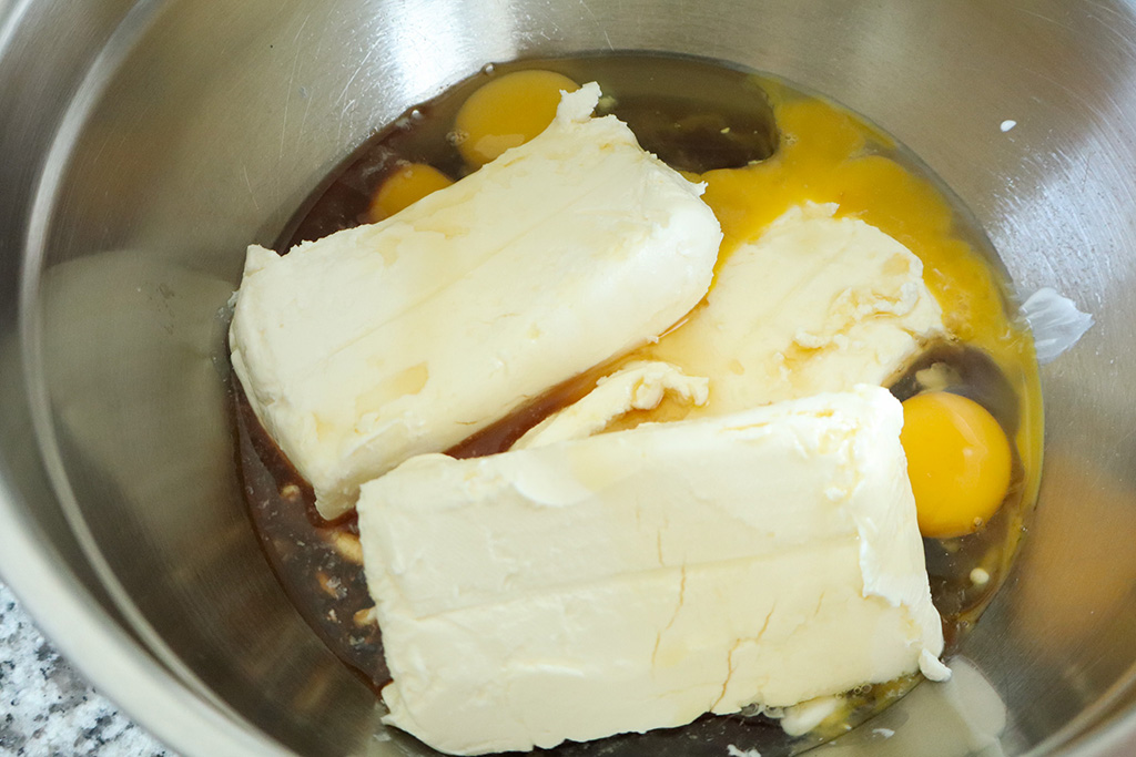 ingredients for cheesecake filling in stainless steel bowl