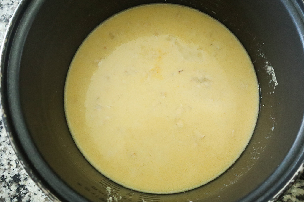 wet ingredients for honey oat bread mixed together in large bowl