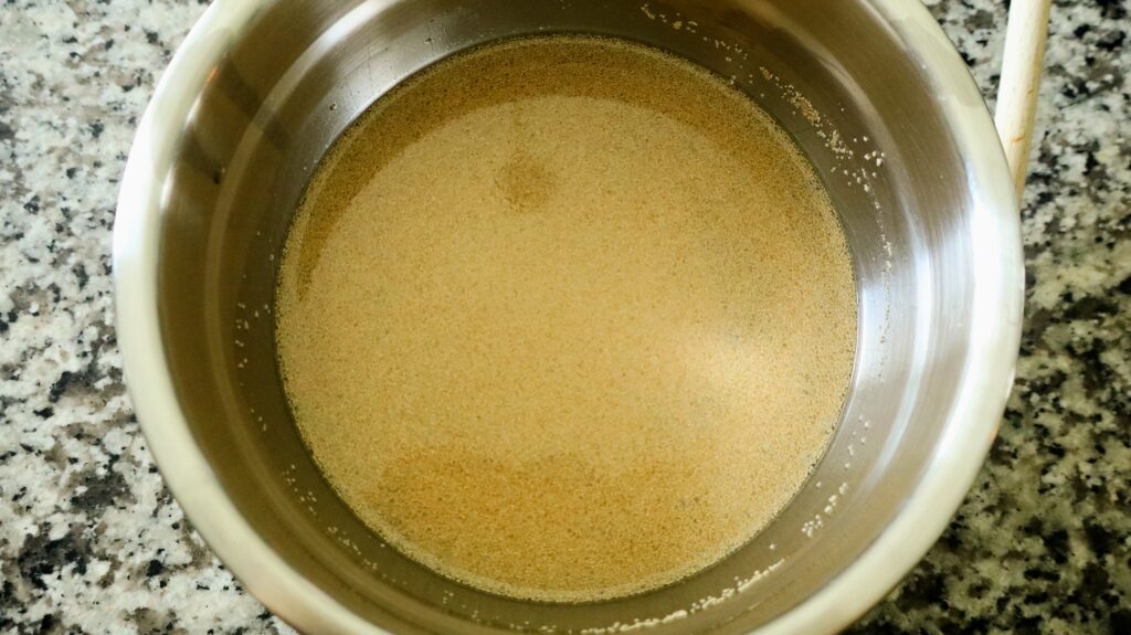 warm apple juice and honey mixed with dry active yeast