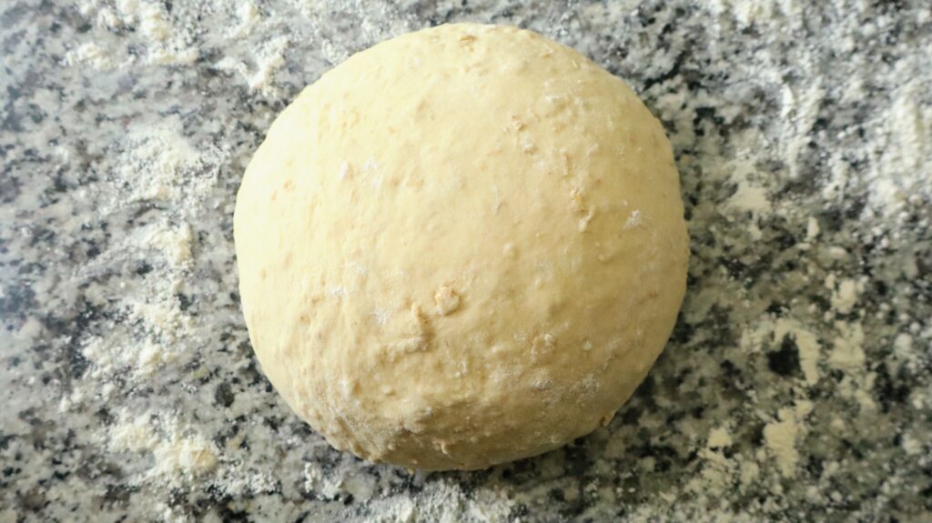 dough ball on floured countertop