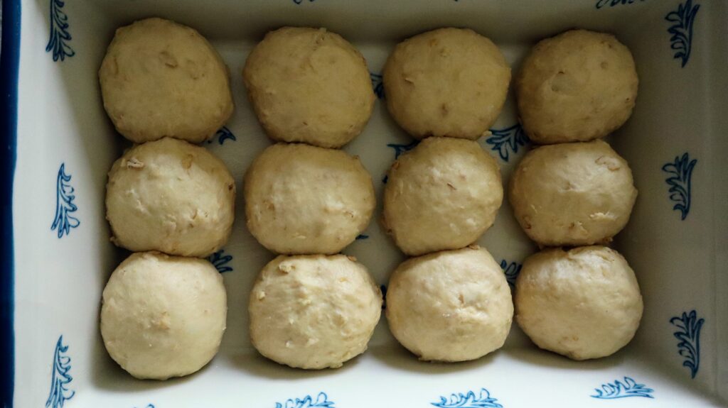 honey oat sweet rolls in baking dish
