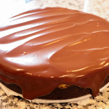 cheesecake topped with dark chocolate ganache