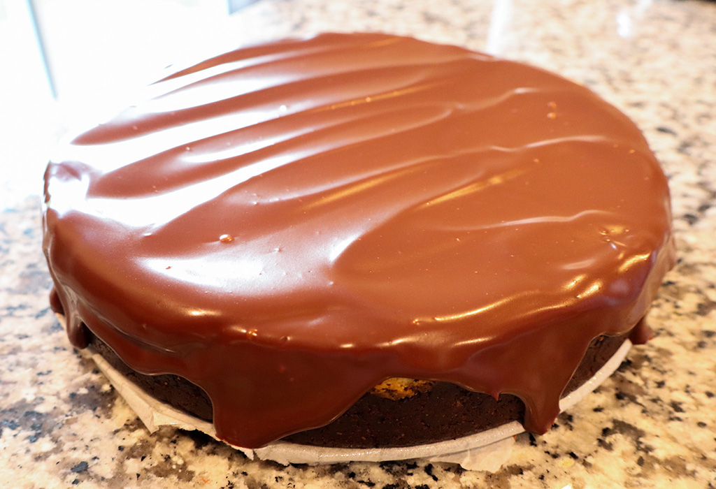 cheesecake topped with dark chocolate ganache