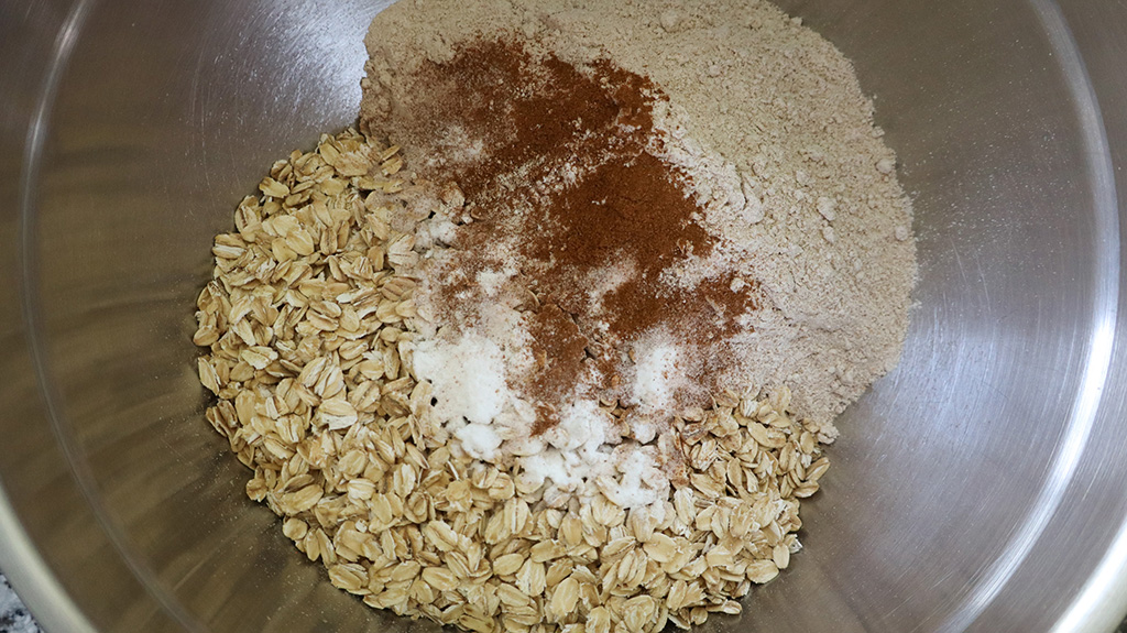 dry ingredients for banana chocolate chip oatmeal bars in mixing bowl