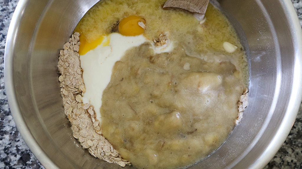 adding wet ingredients to dry ingredients